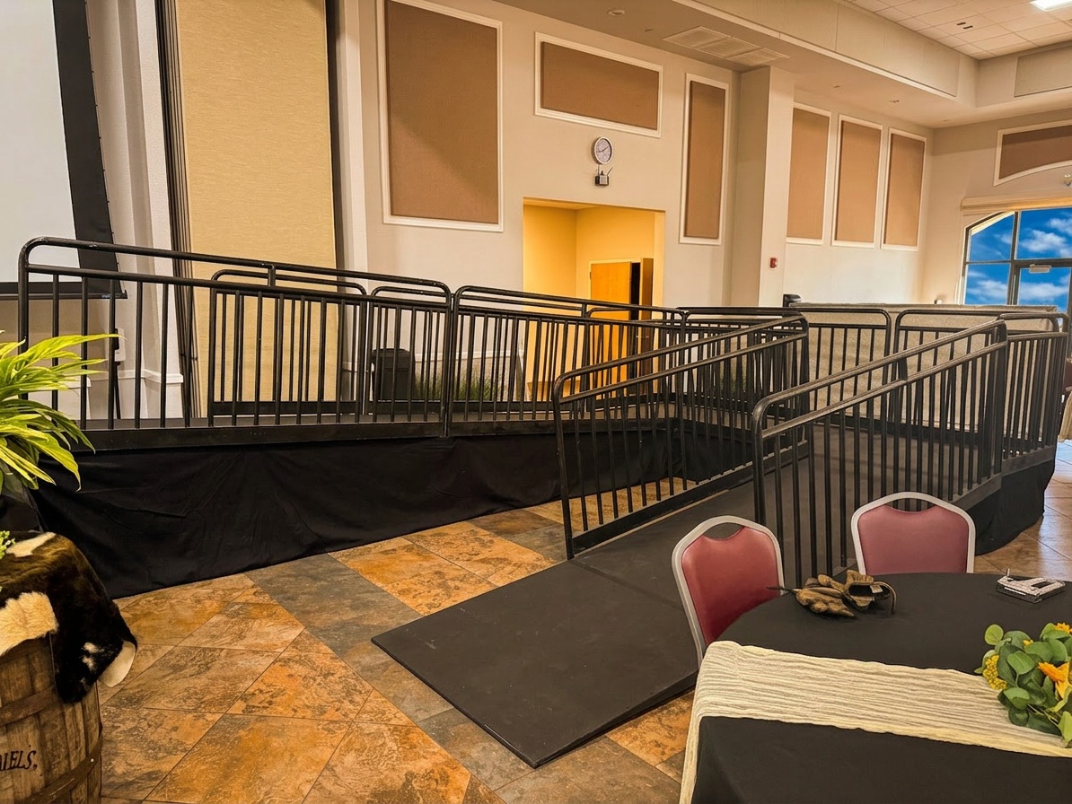 Professional stage installation at Gaylord Palms in Orlando showing ramp configuration and stage deck with guard rails, April 2026