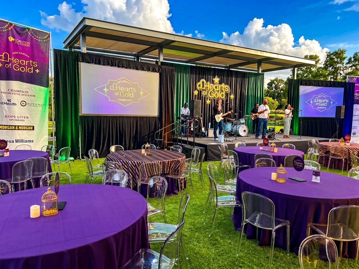 dedicated power drop cable running to a wedding band stage at an outdoor tent reception