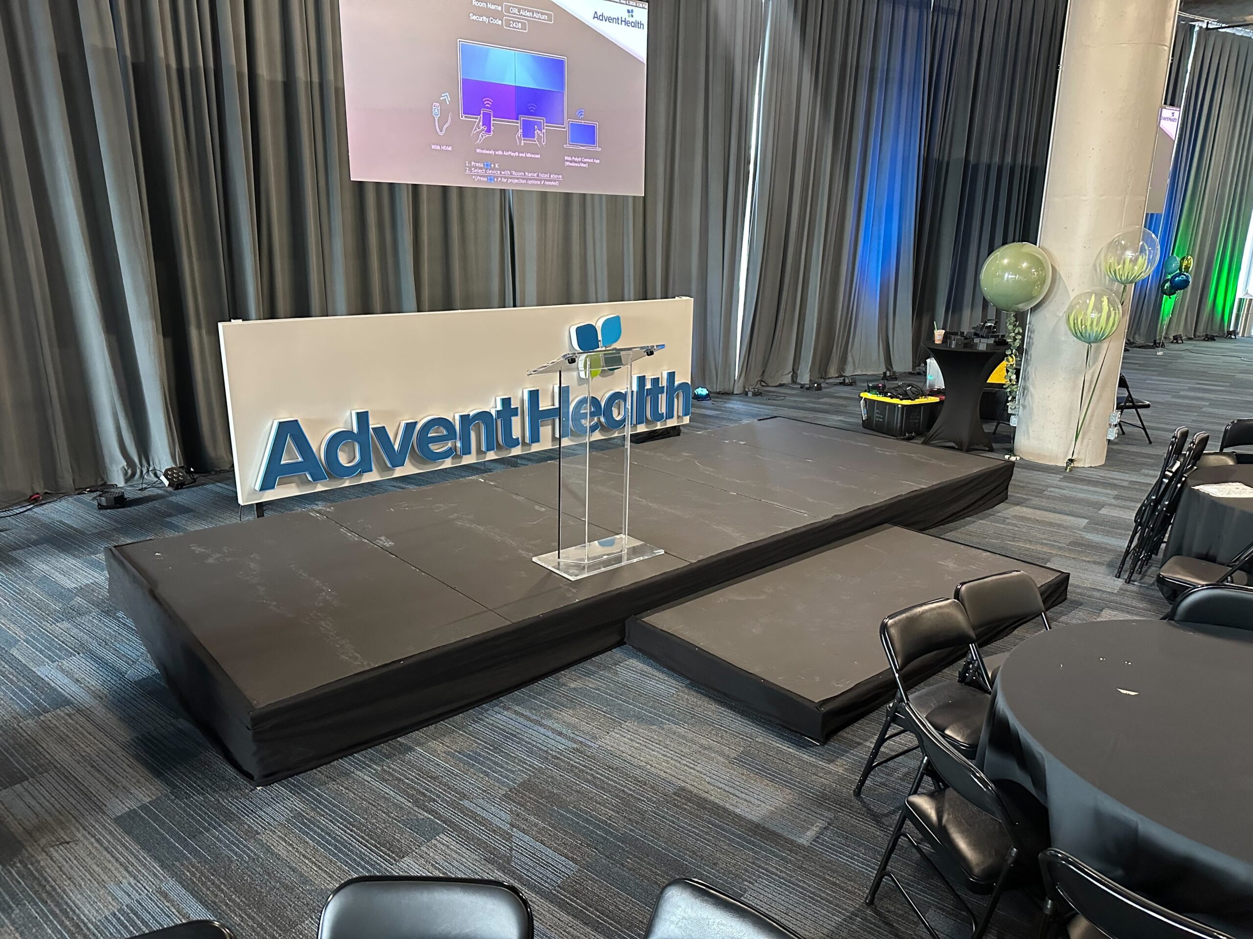 gooseneck microphone mounted on podium at corporate event stage