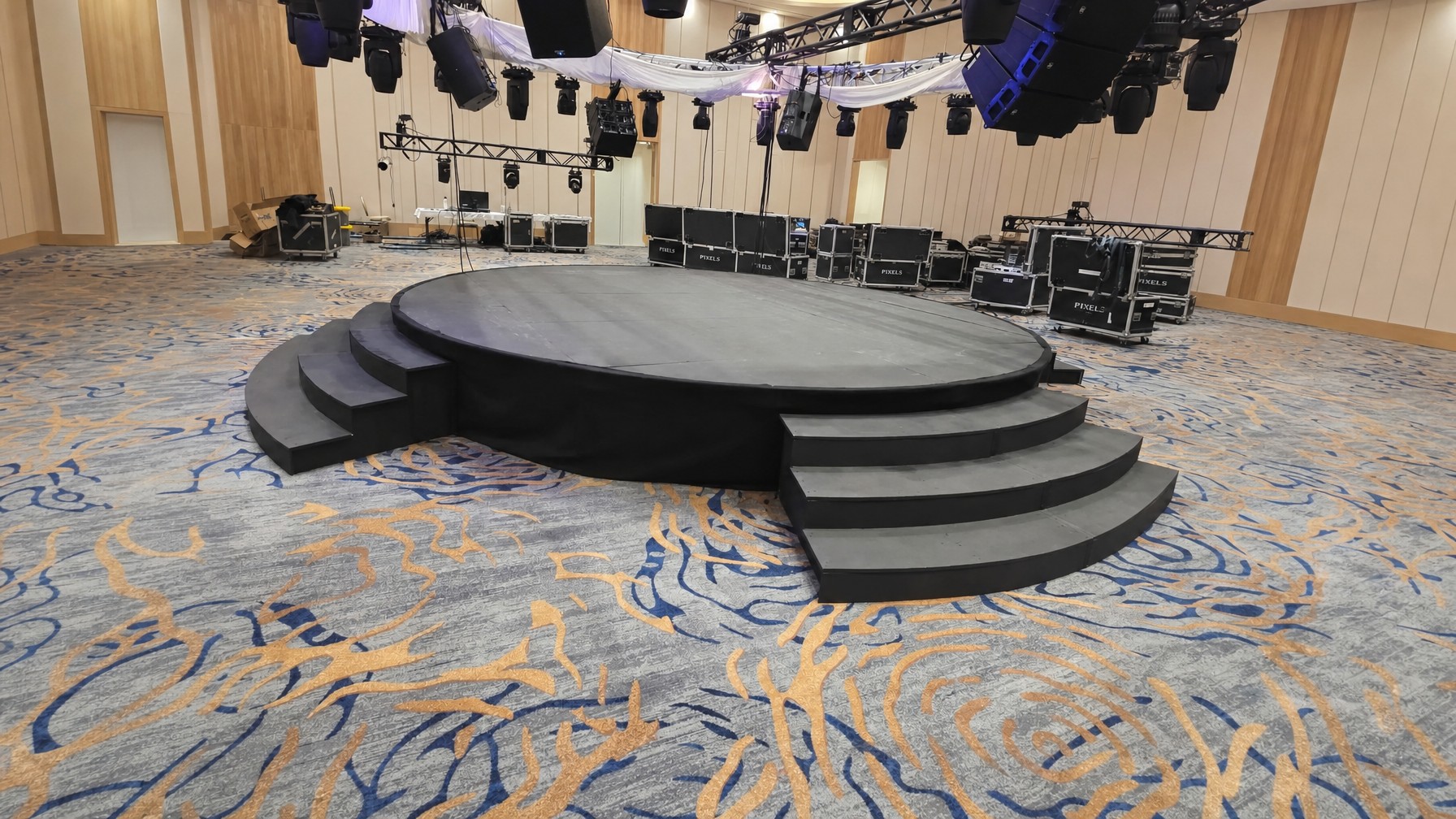 guests dancing around a round stage centerpiece at an outdoor Florida wedding reception