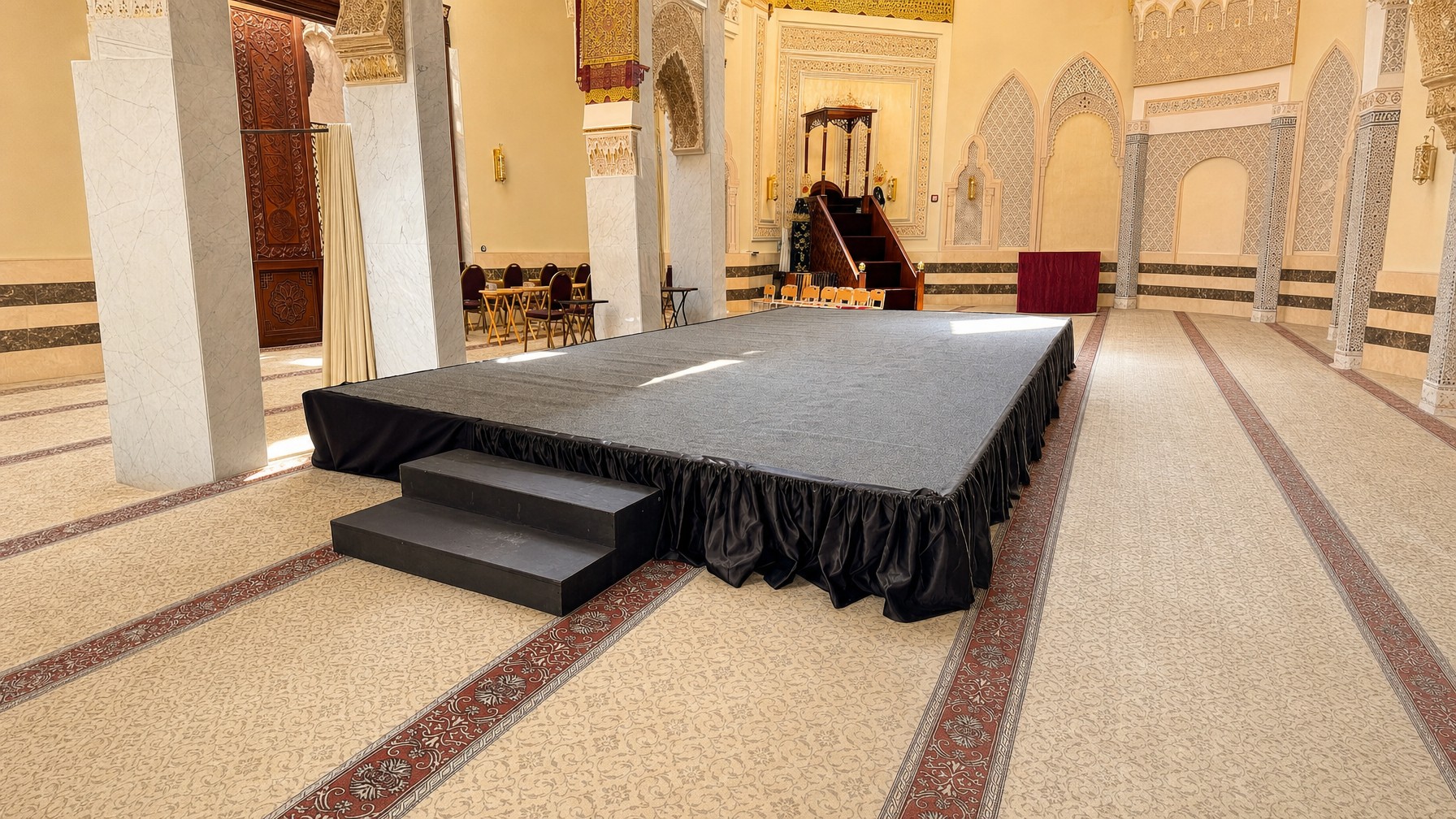 rolls of tent flooring and hard deck panels staged next to an outdoor stage build in Central Florida