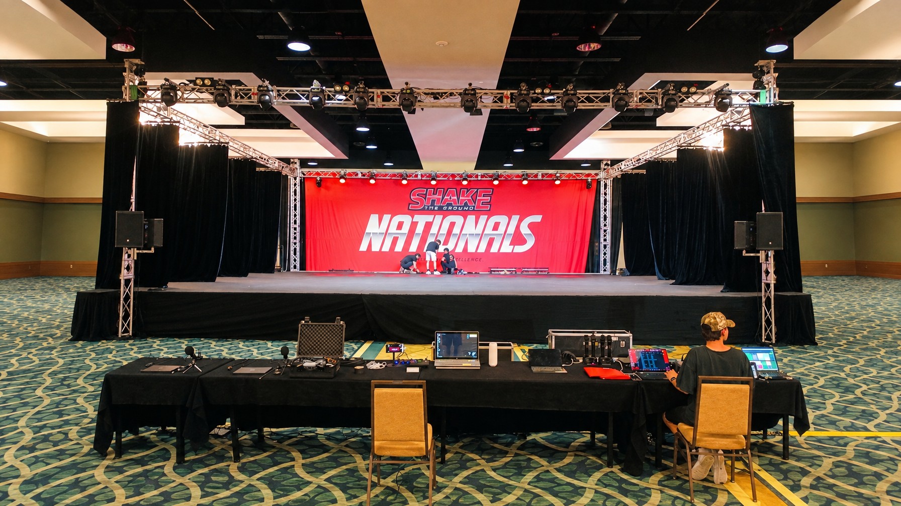 stage lighting rig with front and rear accent lighting on a product reveal platform