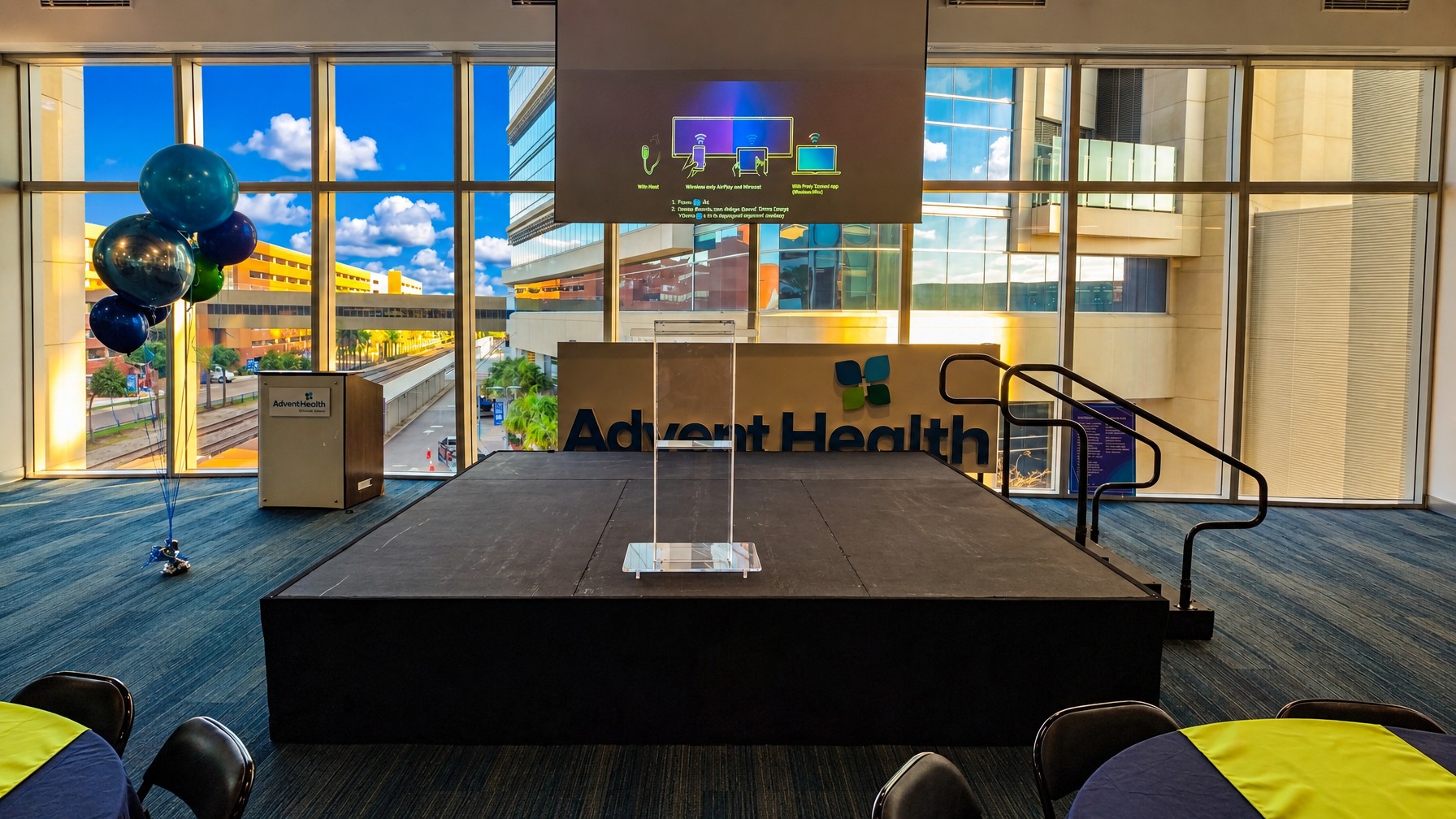 compact 8x8 modular stage deck set up indoors for a single speaker with a podium