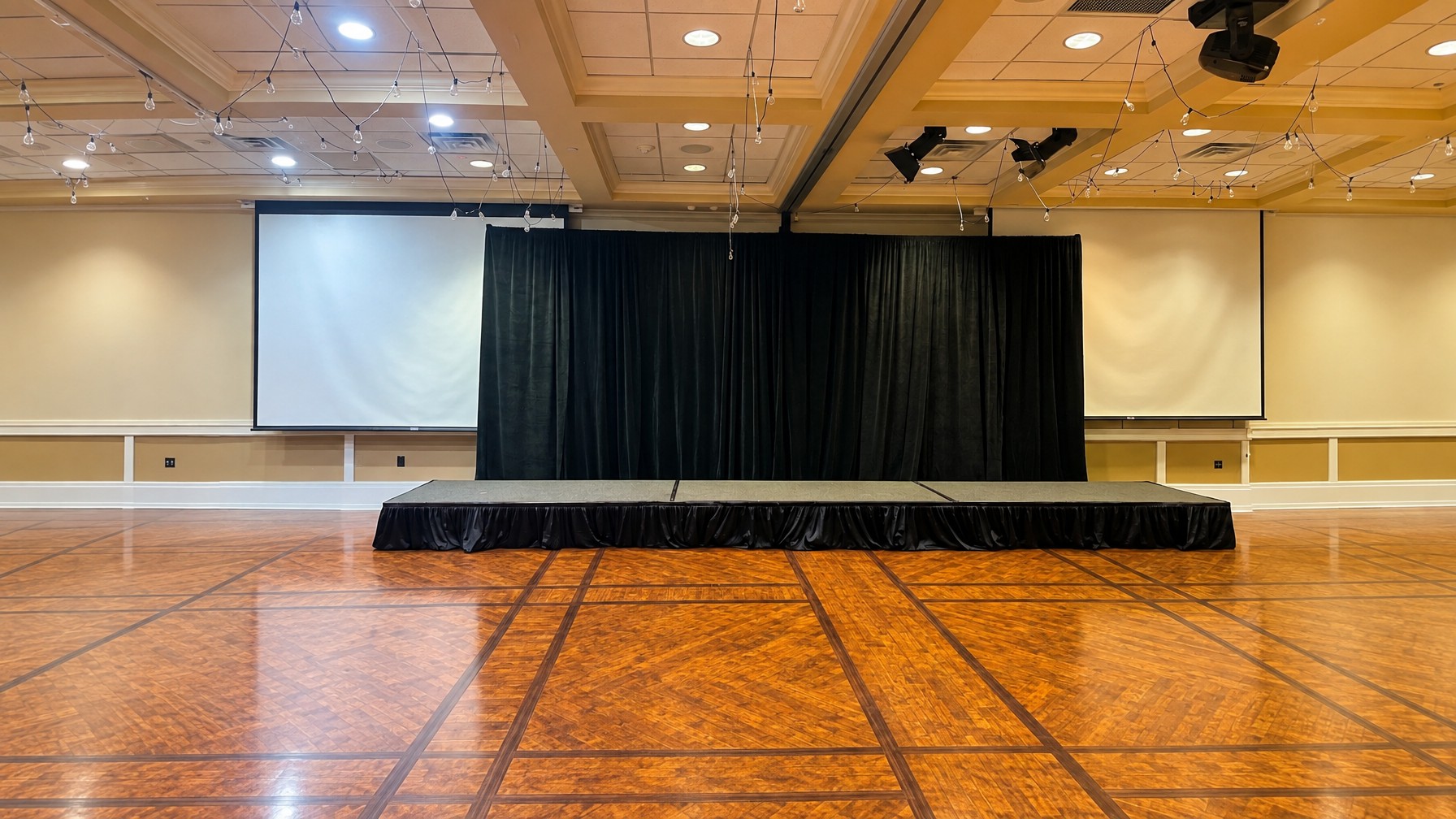 low 8ft stage with skirting and a short ADA-compliant ramp at an Orlando corporate event