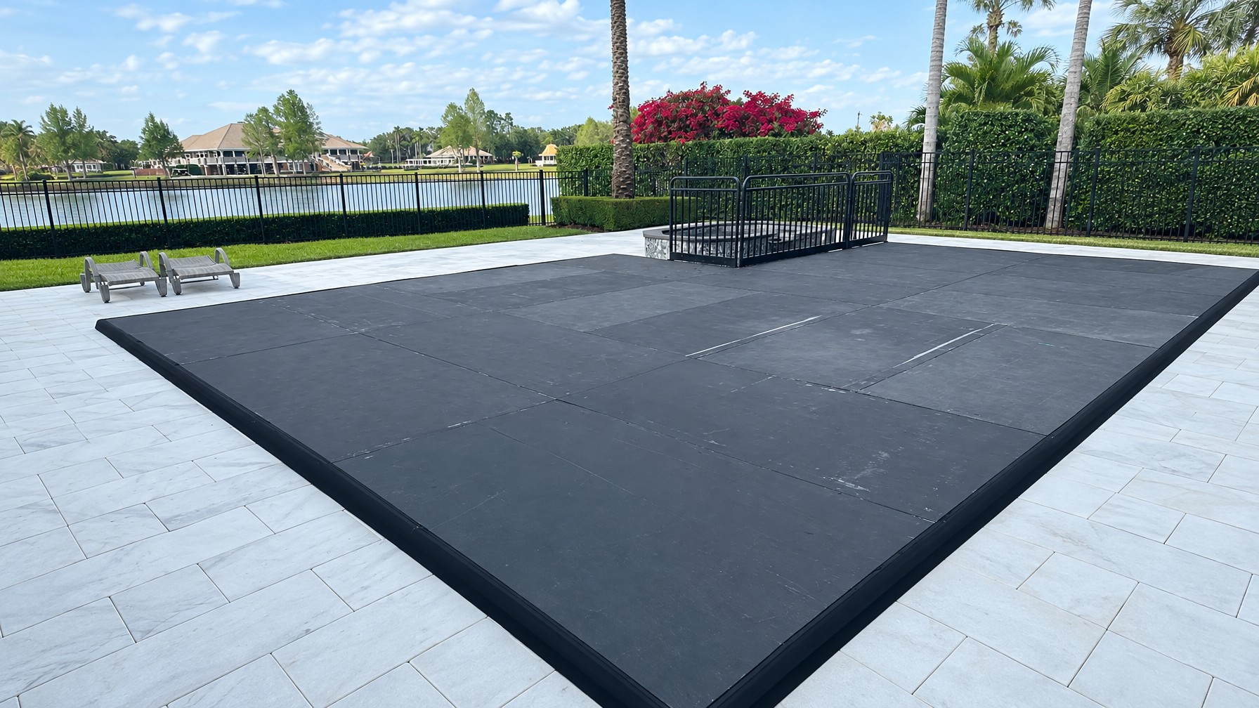 resort pool deck area at a Central Florida property set up for an evening event, string lights overhead