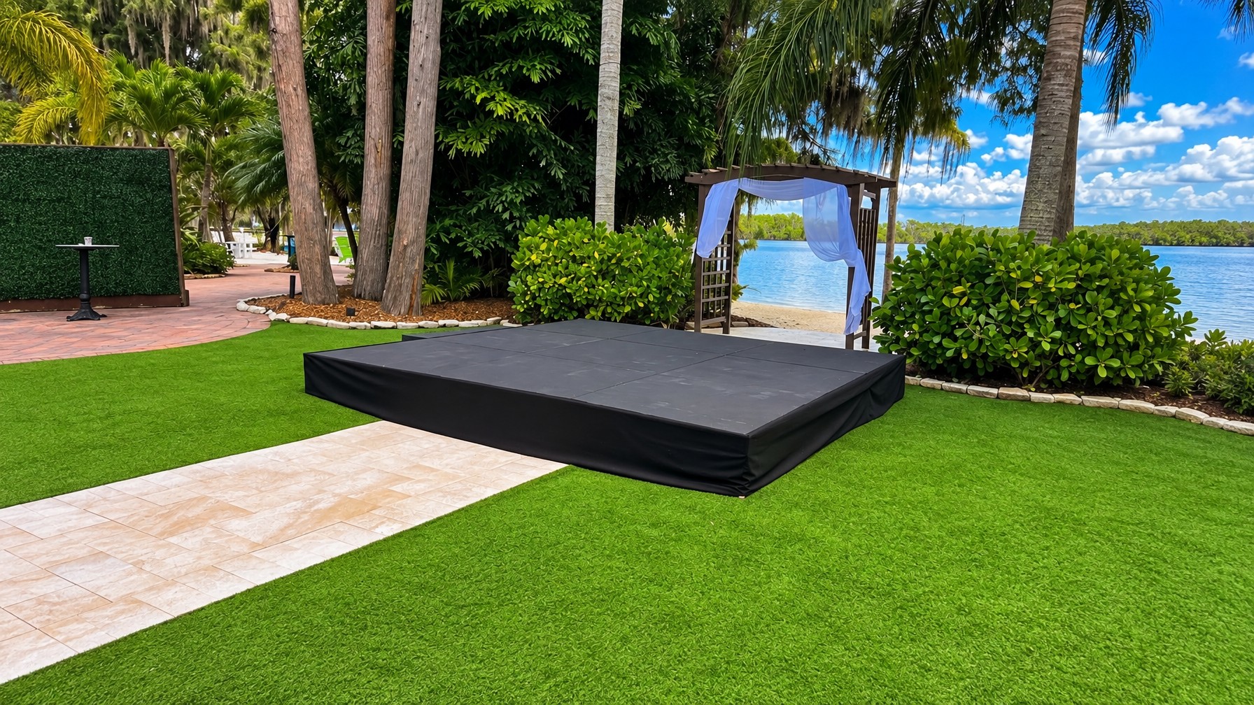 small outdoor ceremony stage with officiant and couple standing on an 8x8 deck